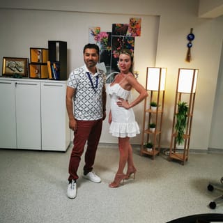 Cosmetocity pose with doctor after aesthetic surgery