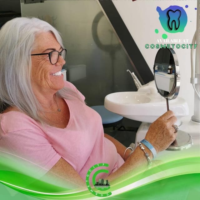 Cosmetocity happy woman getting dental treatment