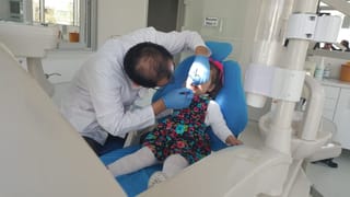 Erdem Azim Clinic A Girl Having a Dental treatment