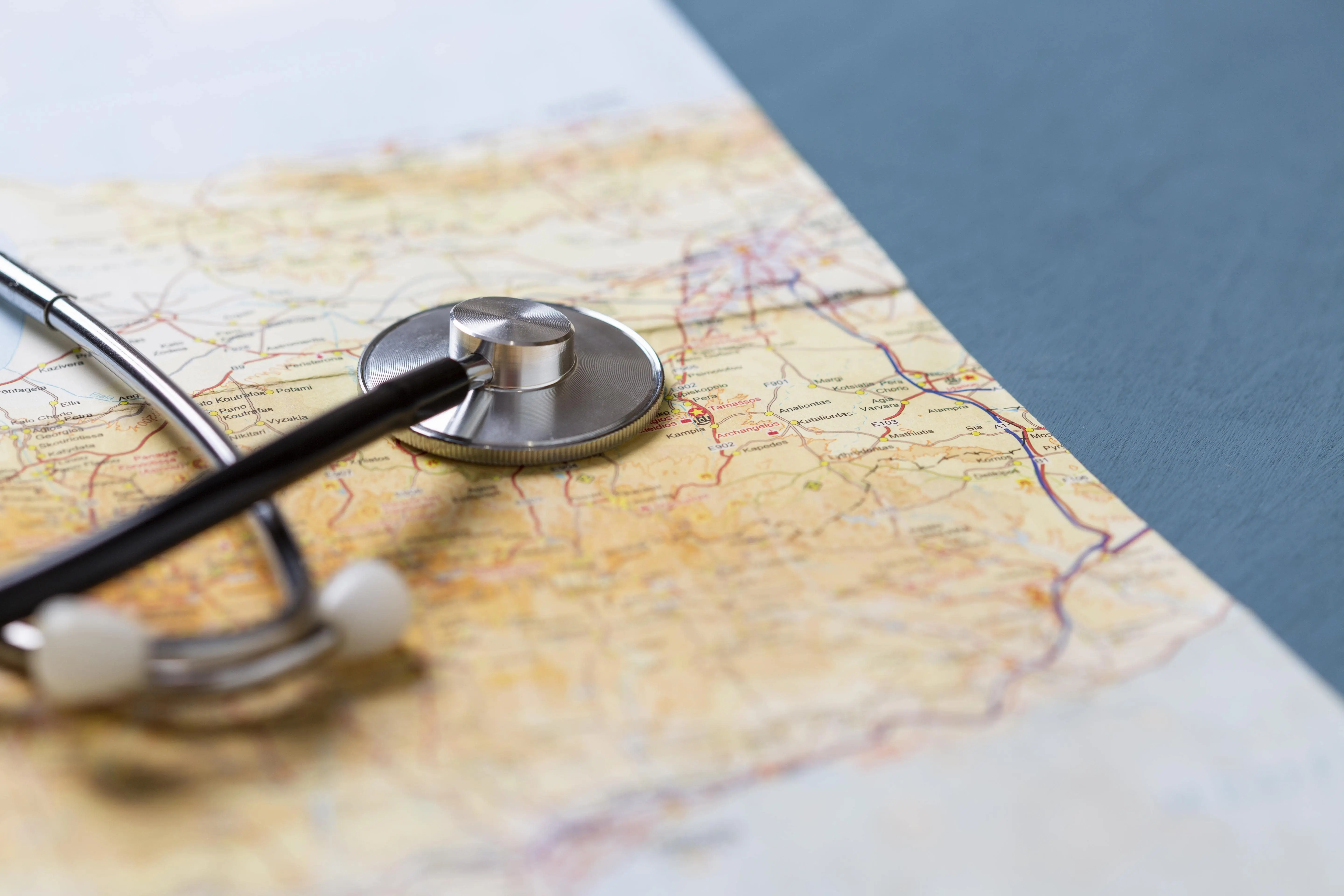 Stethoscope on world map. Global healthcare concept.