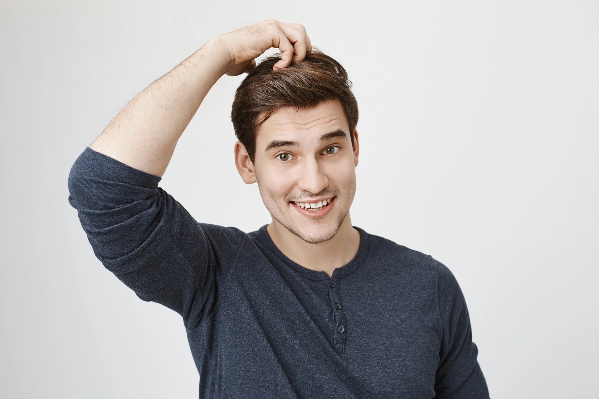Happy man after a successful hair loss treatment